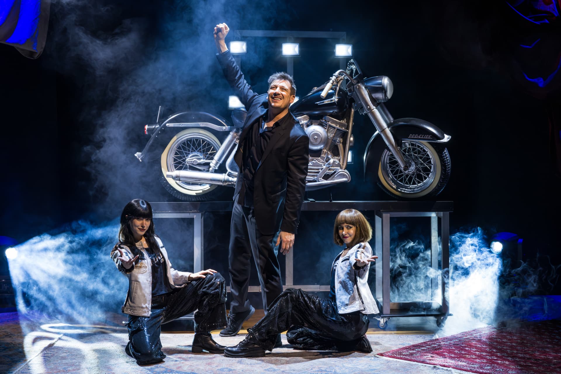 Motorbike reveal with the cast on stage